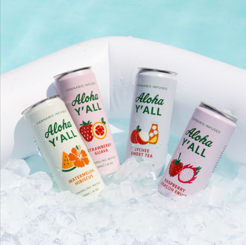 Four cans of Aloha Y'all cannabis-infused drinks on a white surface with a light blue background.
