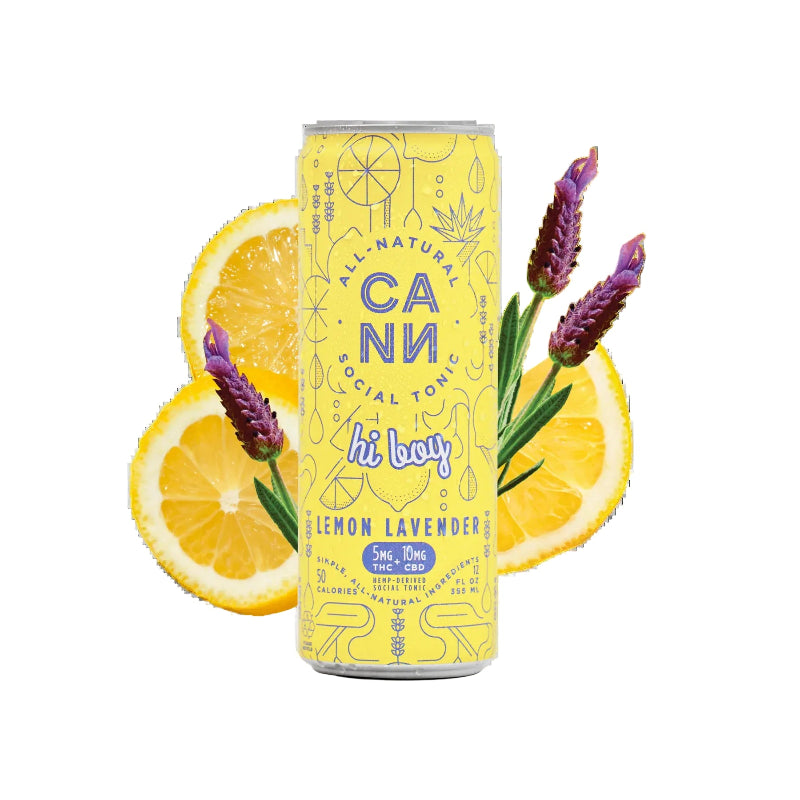 A yellow can of Cann Social Tonic Lemon Lavender on a white background, styled with lemon slices and lavender sprigs. The can features blue and purple text and illustrations.