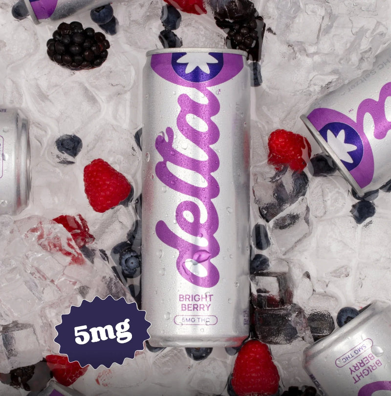 Delta Bright Berry can with berries and ice cubes on a white background