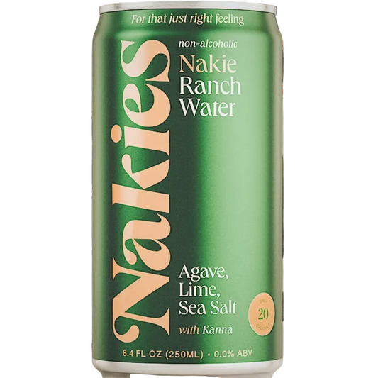 A green can of Naklie Ranch Water with cream and white lettering, set against a background of dried agave leaves.