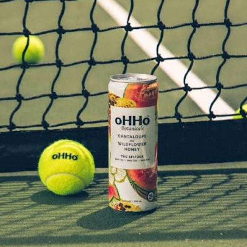 oHHo can and tennis ball on a tennis court